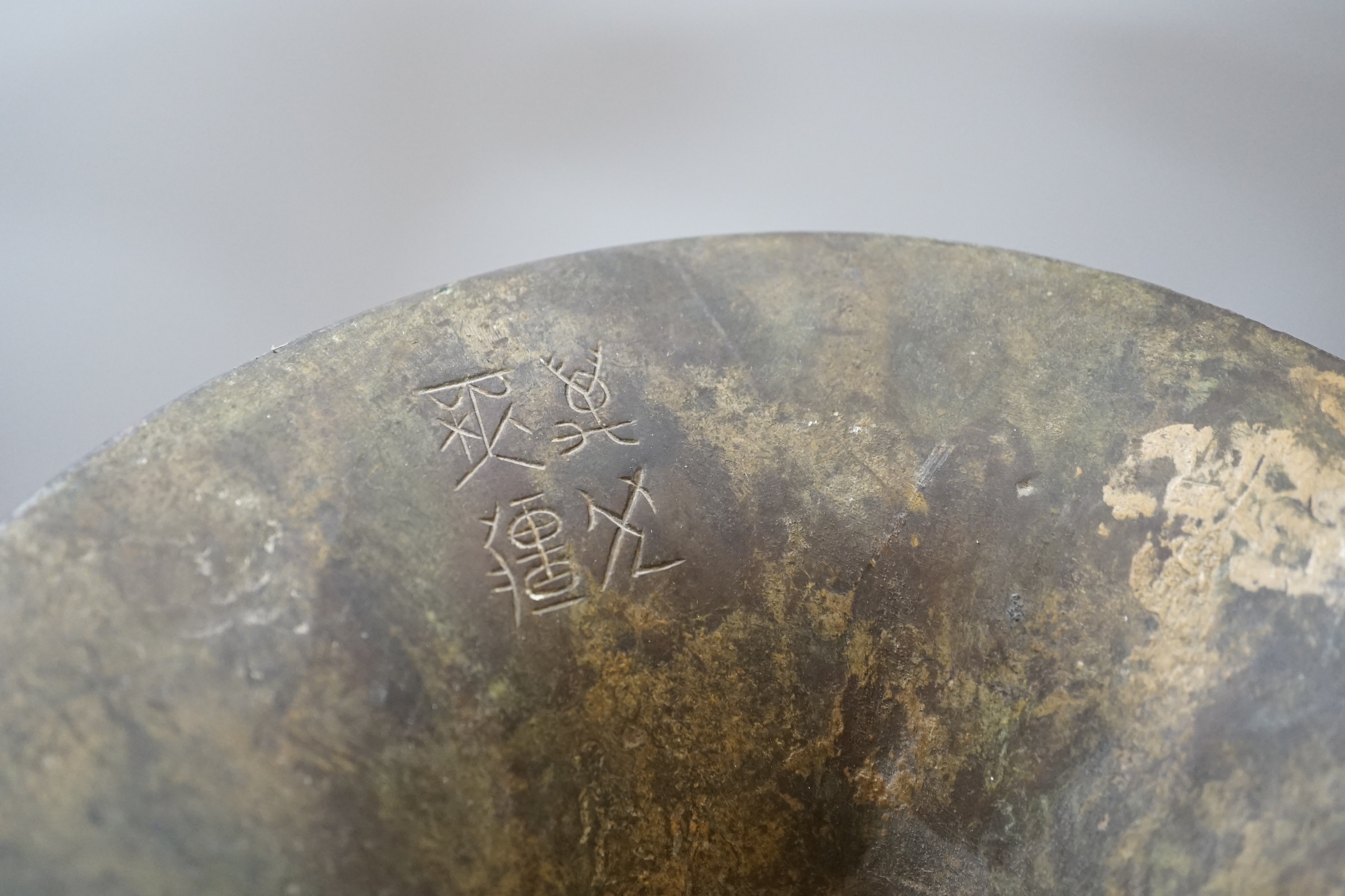 A Chinese bronze gu vase, a 19th century Chinese blue and white vase and a Tibetan teapot, tallest 34cm